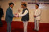 Meghalaya CM, Dr Donkupar Roy presenting the Meghalaya IT Award to one of the meritorious students at the Award ceremony