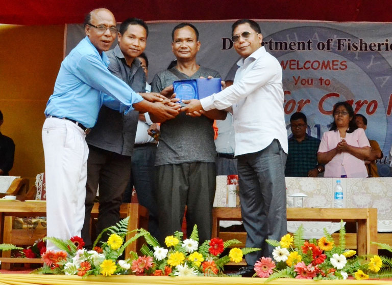 Chief Minister Dr Mukul Sangma awards the best fish santuary to Wachi Wari, Rombagre during the Aquafest 2017 at Tura