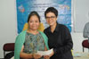 Ampareen Lyngdoh Minister Urban Affairs hand over the cheque to one of the school during the implementation of IEDSS Scheme