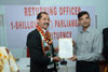 Shri Sanjay Goyal hands over the Winning Certificate to Shri Vincent Pala