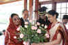 Her Excellency the President of India Smti Pratibha Patil being presented a bouquet of flowers by the Lady Governor of Meghalaya, Smti R Menon on her arrival at the Raj Bhavan, Shillong