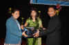 Meghalaya CM, Dr. Mukul Sangma hands over the laptop to a student at the Meghalaya IT Award Ceremony held at Shillong 