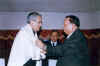Meghalaya CM, Dr D D Lapang presenting a shawl to the Governor of Meghalaya, Mr B.L. Joshi at a farewell meeting held in his honour organised by the State Government at Hotel Pinewood