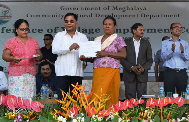 CM Dr Mukul Sangma presents awards to best performing fair price shop dealers during the conference of VECs